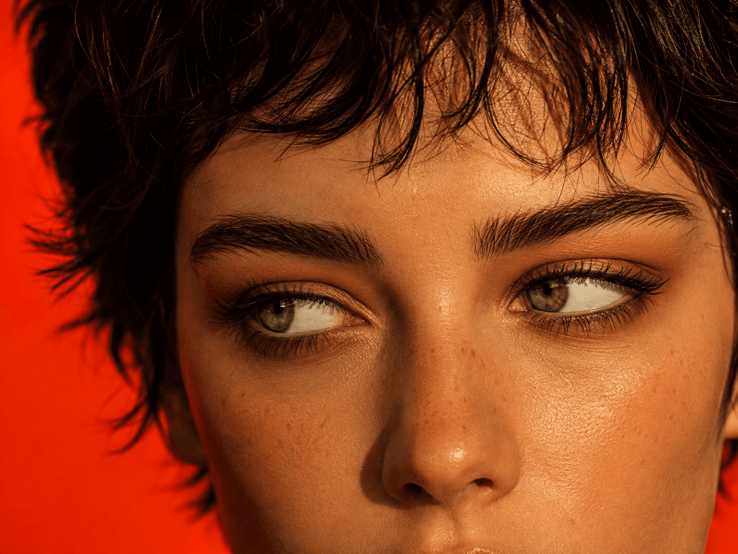 Portrait against an orange wall